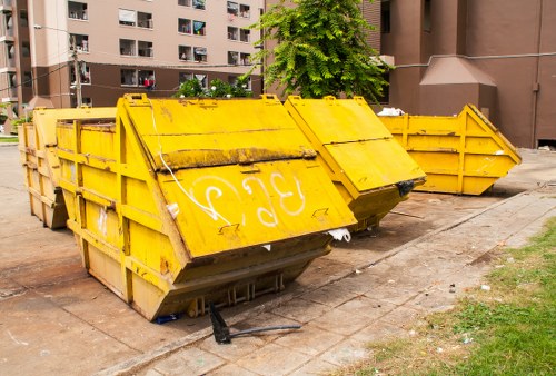 Enclosed and lockable skip parked in an urban area of Alperton