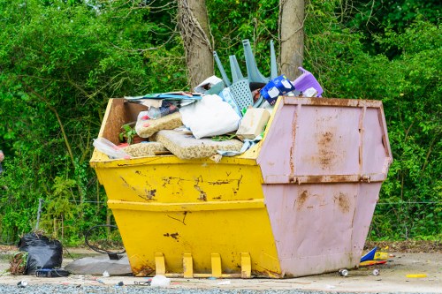Alperton neighborhood street with a skip placed legally