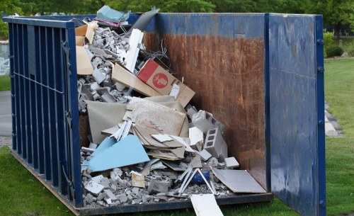 Construction site with builders waste being removed in Alperton