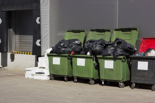Professional skip hire service team delivering a lockable skip