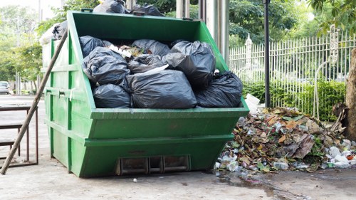 Workers managing construction debris efficiently